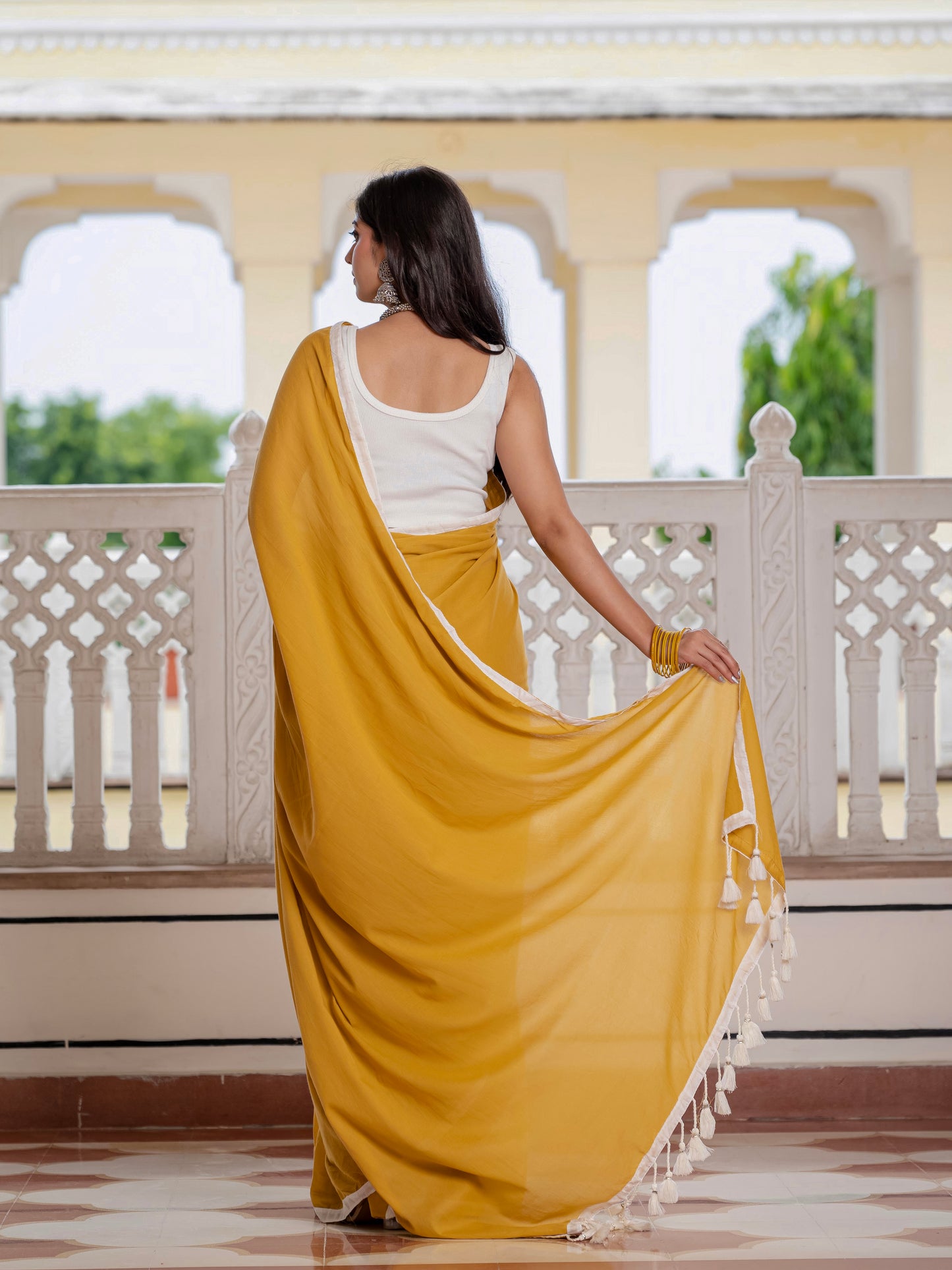Mustard saree with tussells