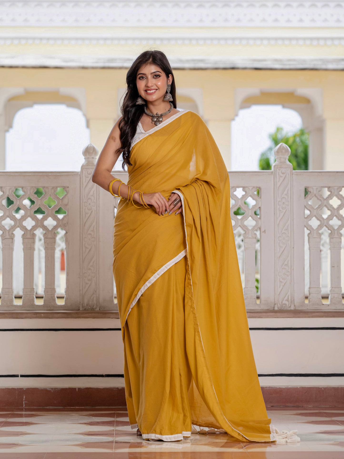 Mustard saree with tussells