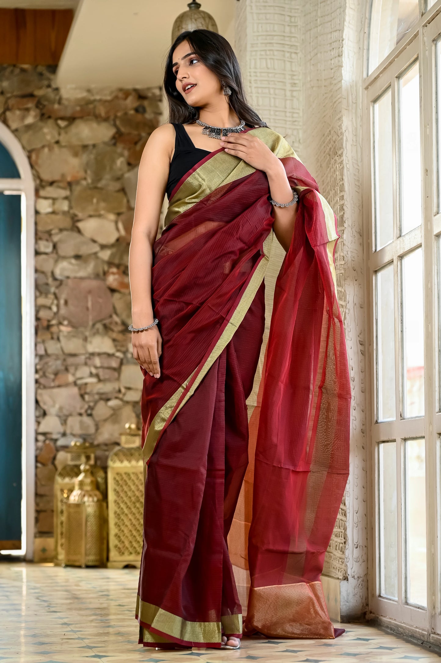 Maroon color kota silk saree with heavy zari golden border