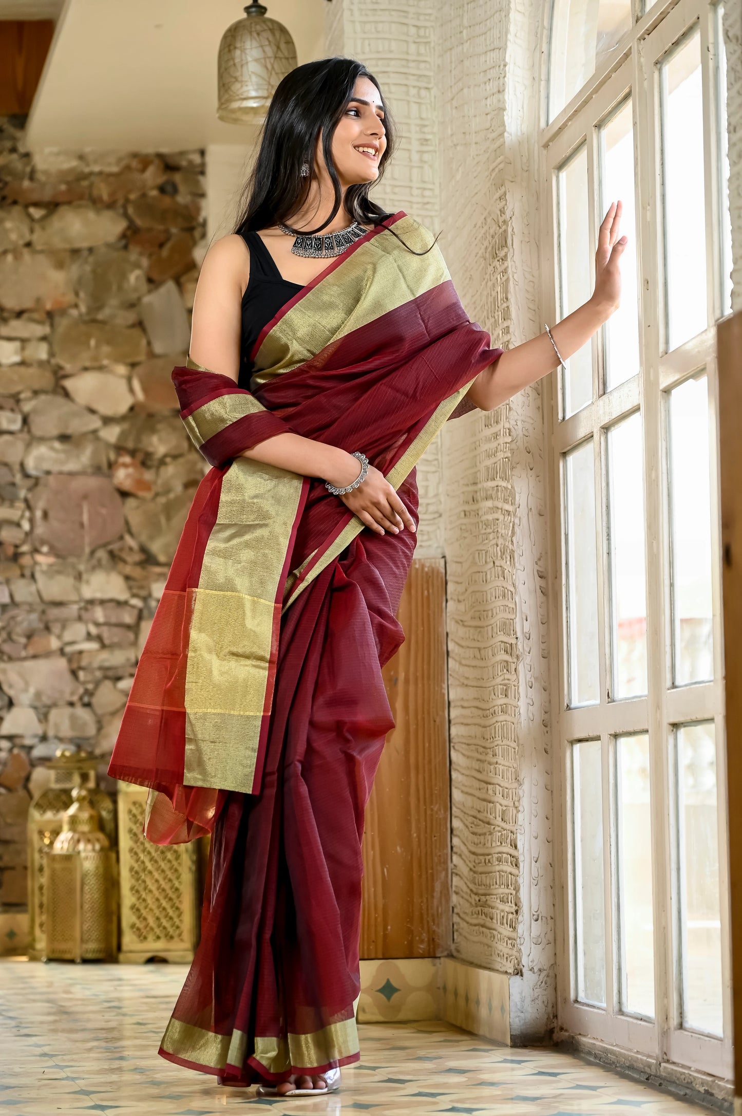 Maroon color kota silk saree with heavy zari golden border
