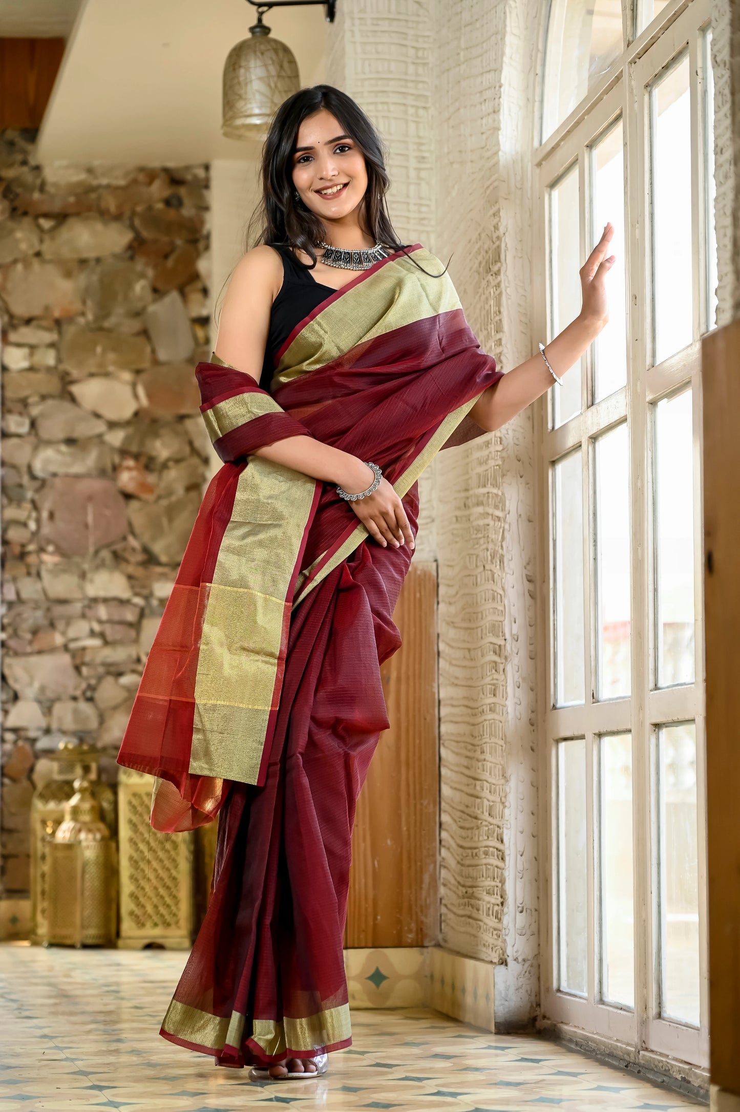 Maroon color kota silk saree with heavy zari golden border