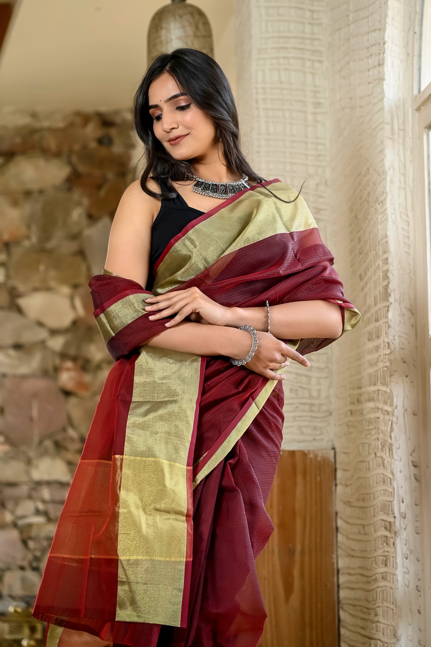 Maroon color kota silk saree with heavy zari golden border