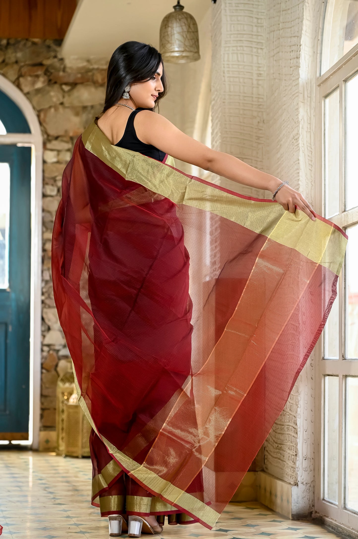 Maroon color kota silk saree with heavy zari golden border
