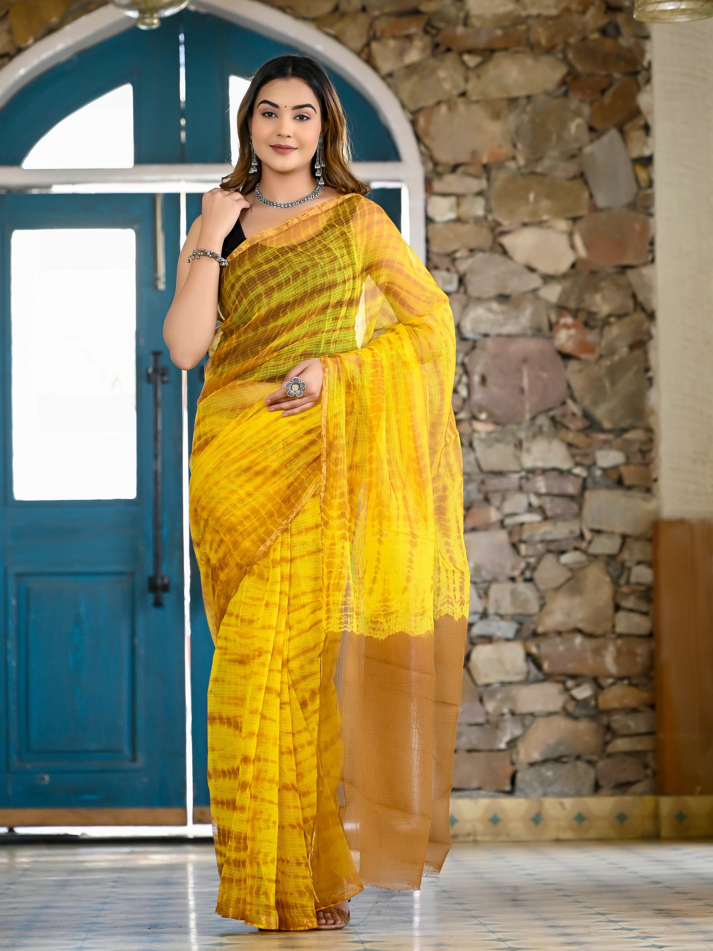 Yellow tie die print pure kota doria saree