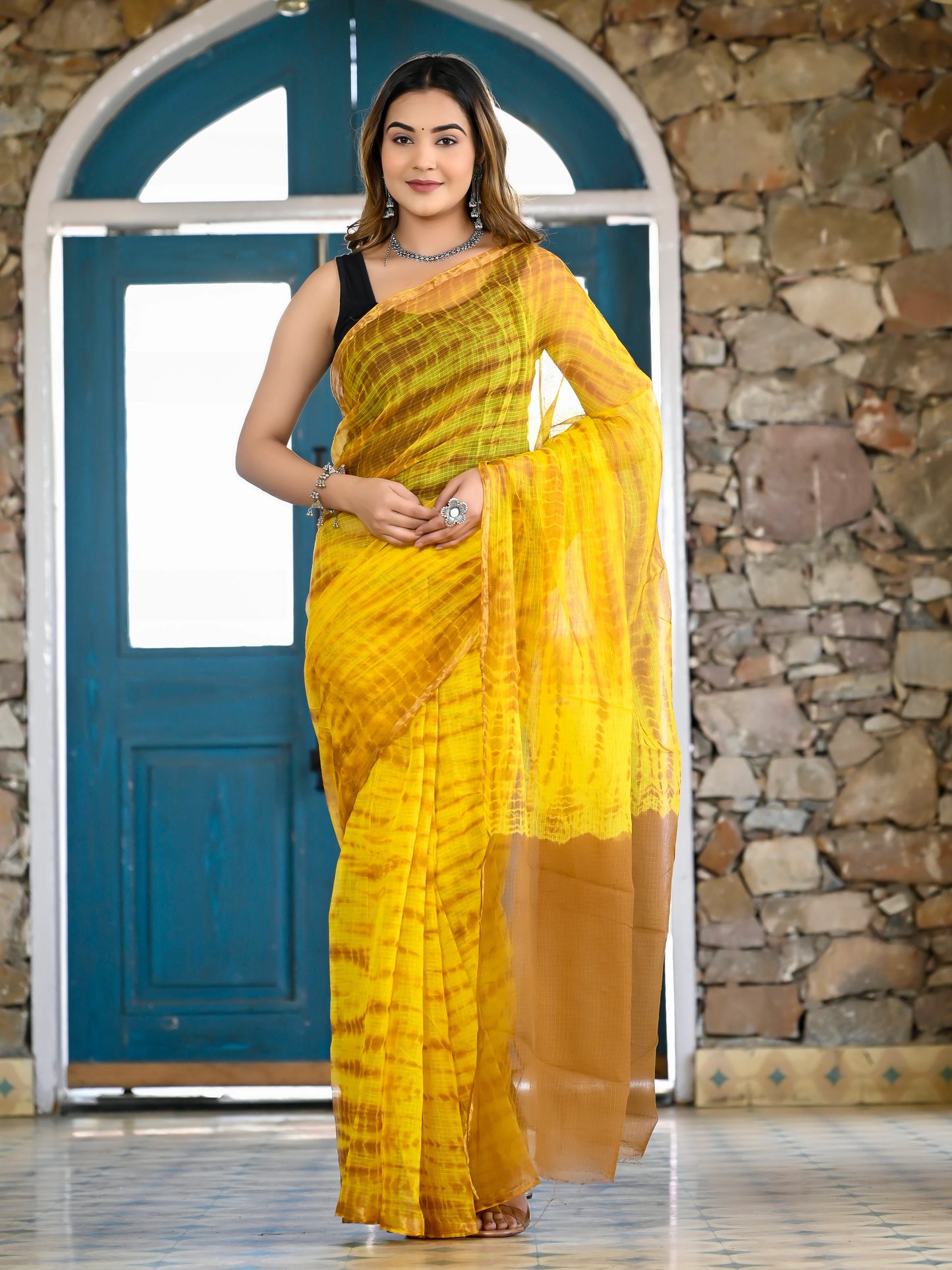 Yellow tie die print pure kota doria saree