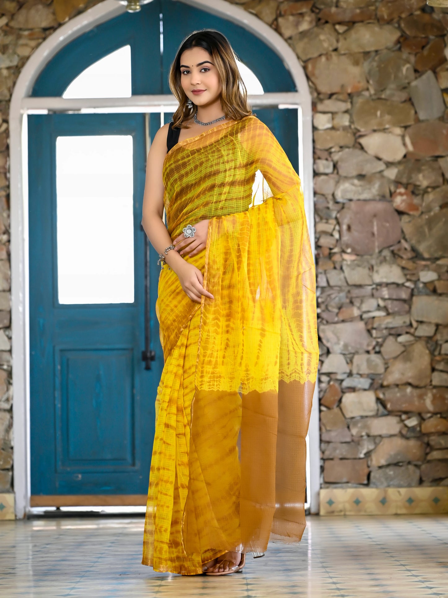 Yellow tie die print pure kota doria saree