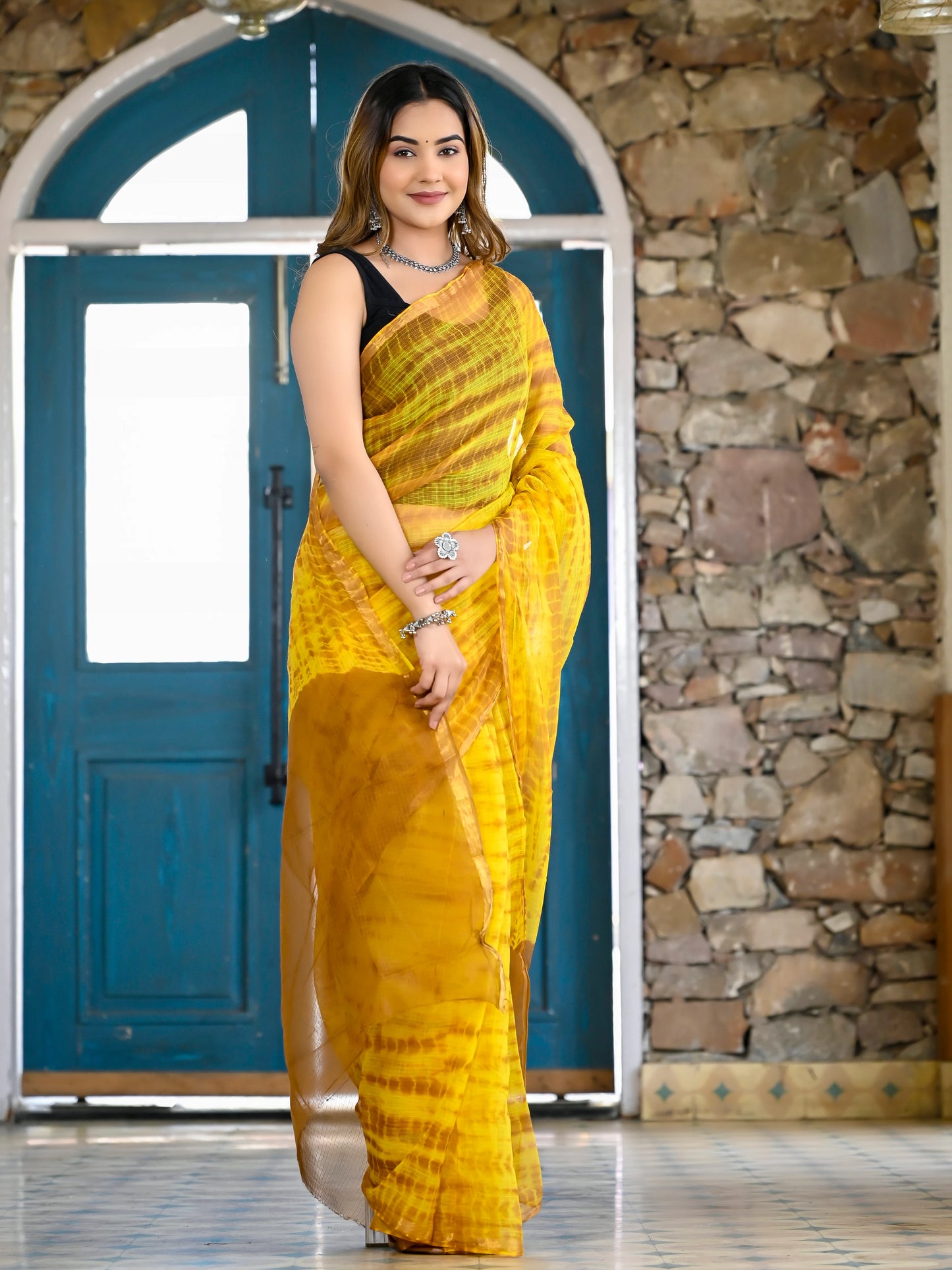 Yellow tie die print pure kota doria saree