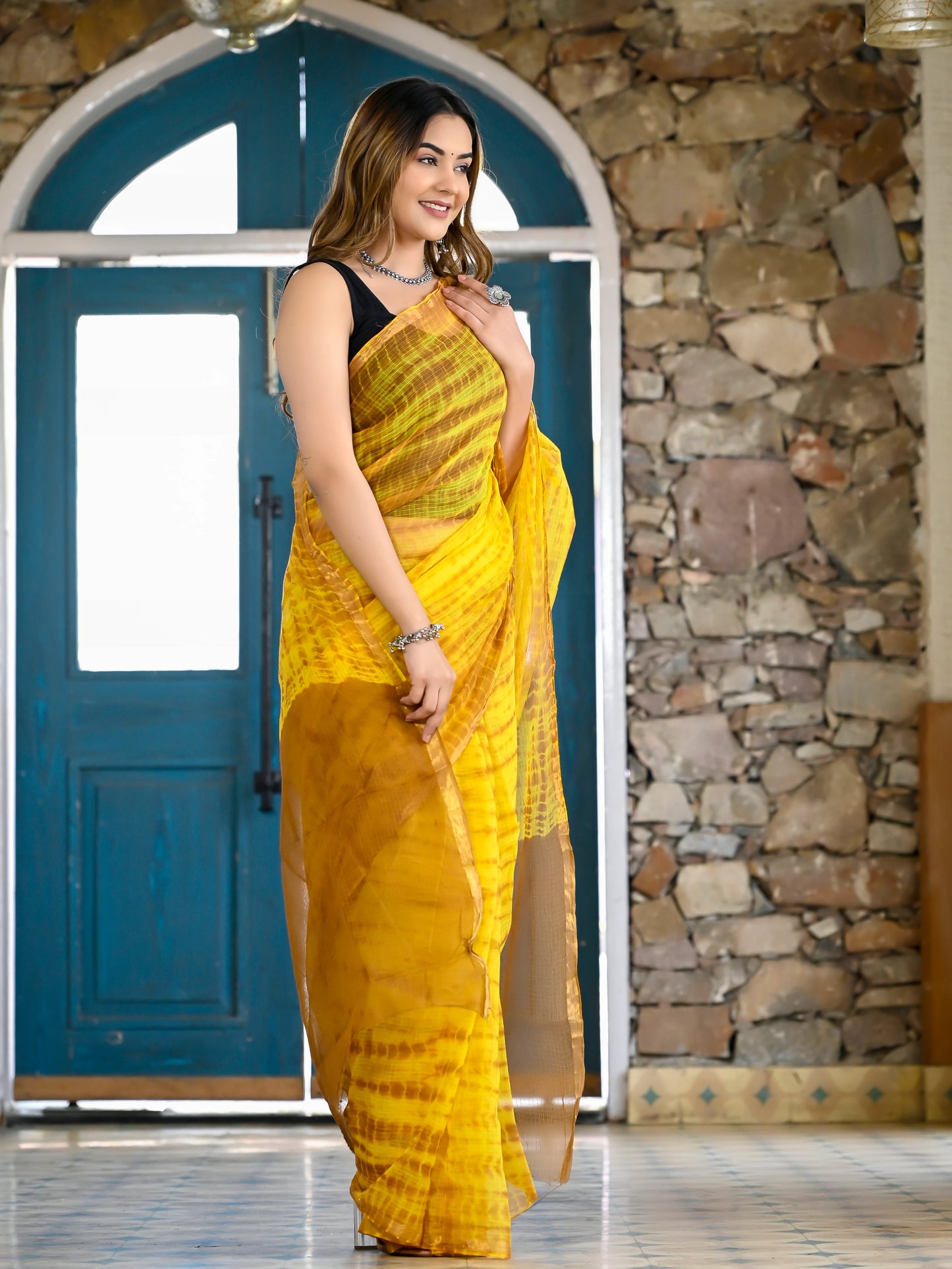 Yellow tie die print pure kota doria saree