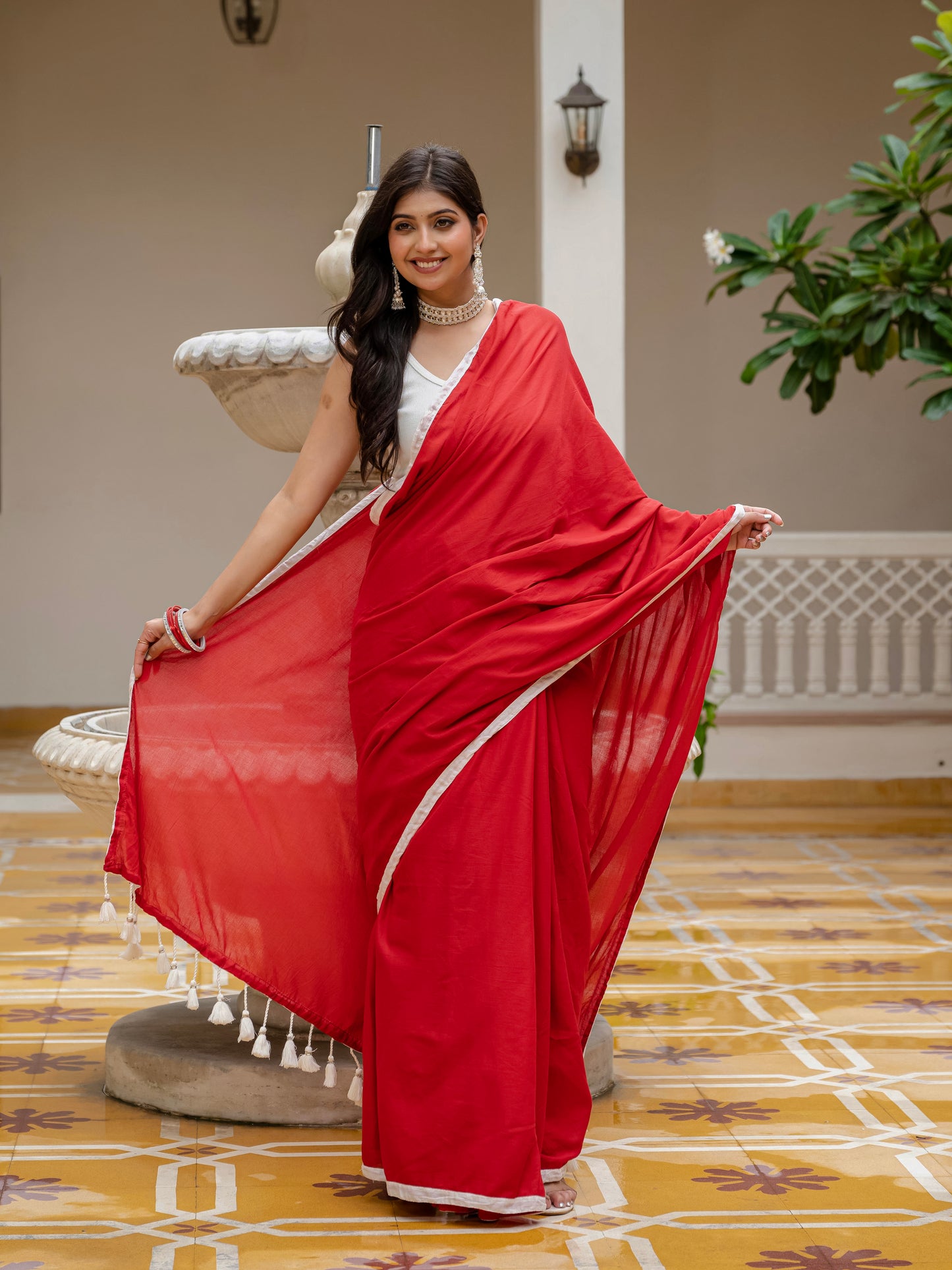 Red saree with tussels