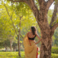 Light mustard cotton saree with red border and tussels