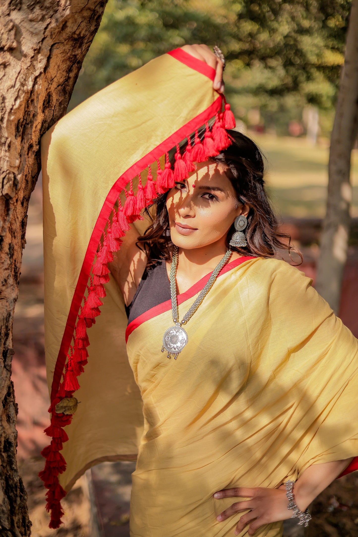 Light mustard cotton saree with red border and tussels
