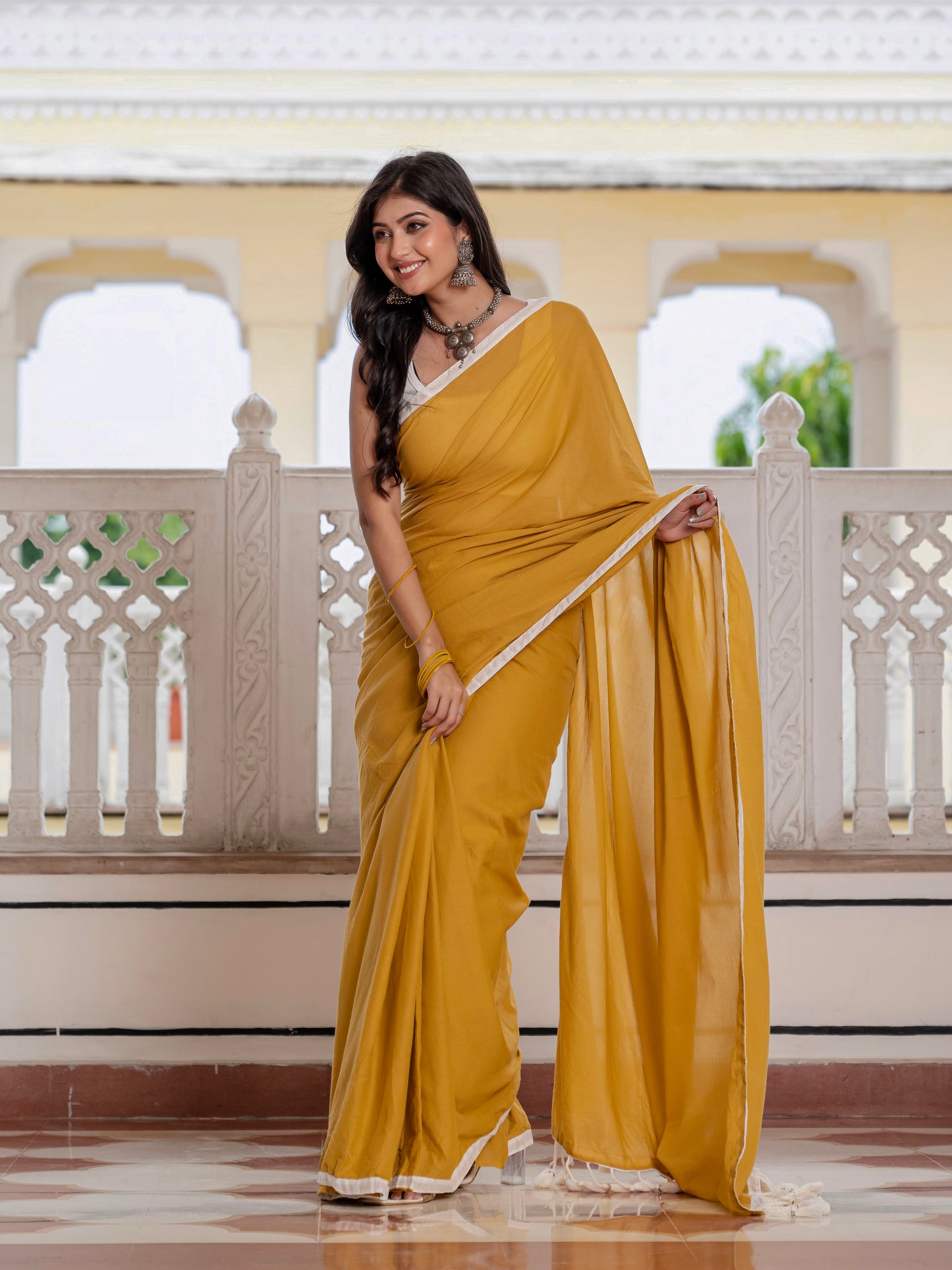 Mustard saree with tussells