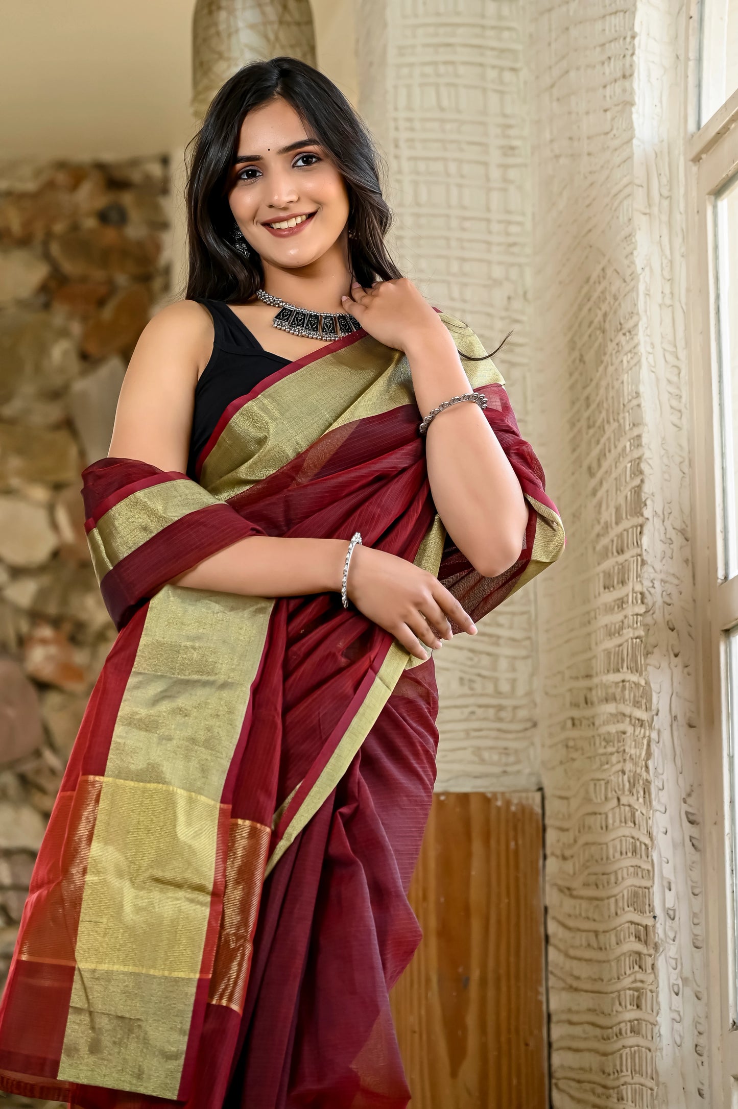 Maroon color kota silk saree with heavy zari golden border