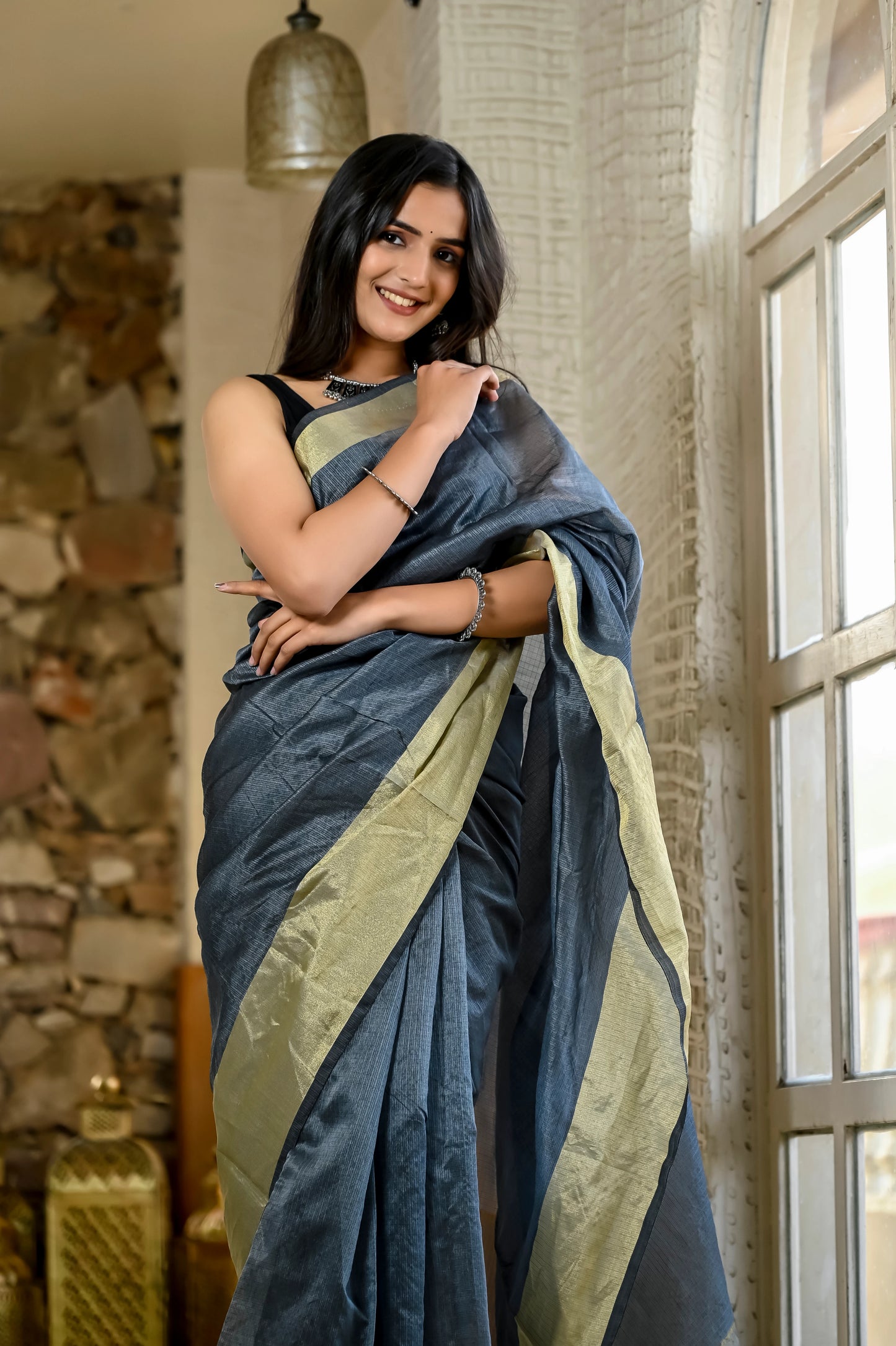 Grey color kota silk saree with heavy zari golden border