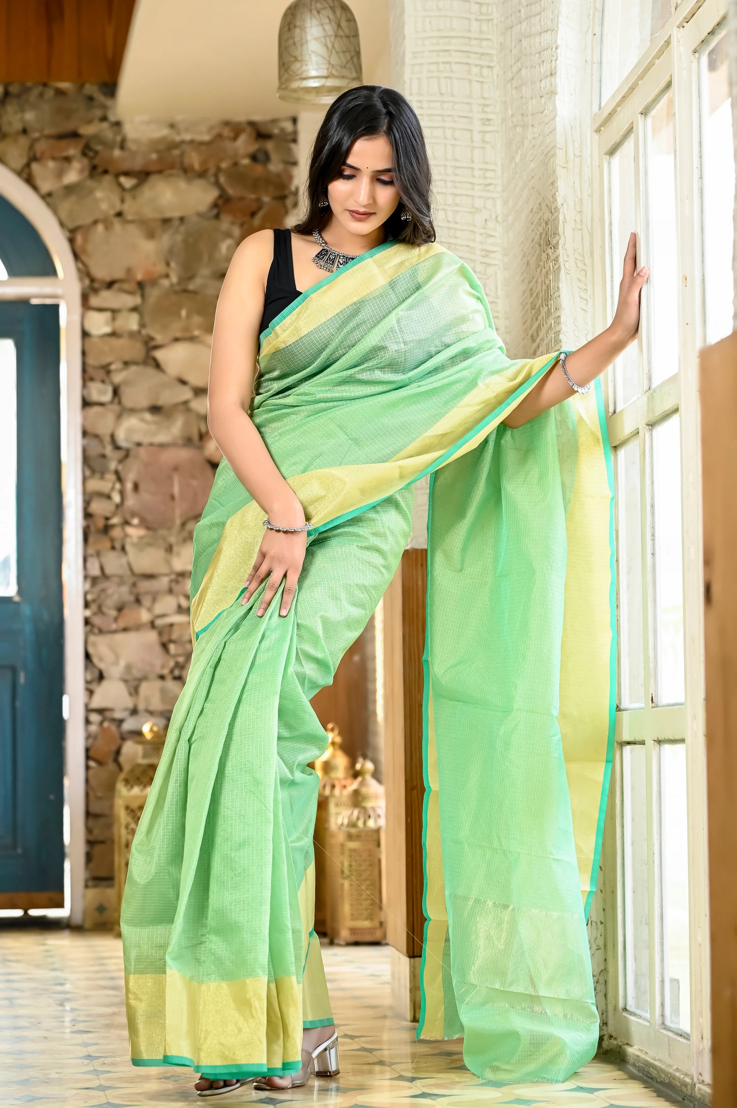 Pista green color kota silk saree with heavy zari border