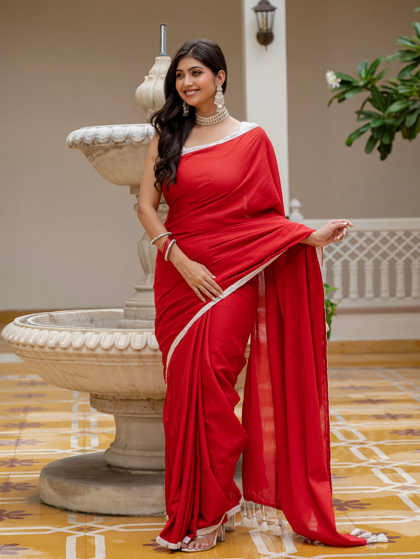 Red saree with tussels